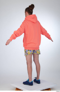 Nigel a-pose blue sneakers dressed floral printed shorts salmon hoodie…